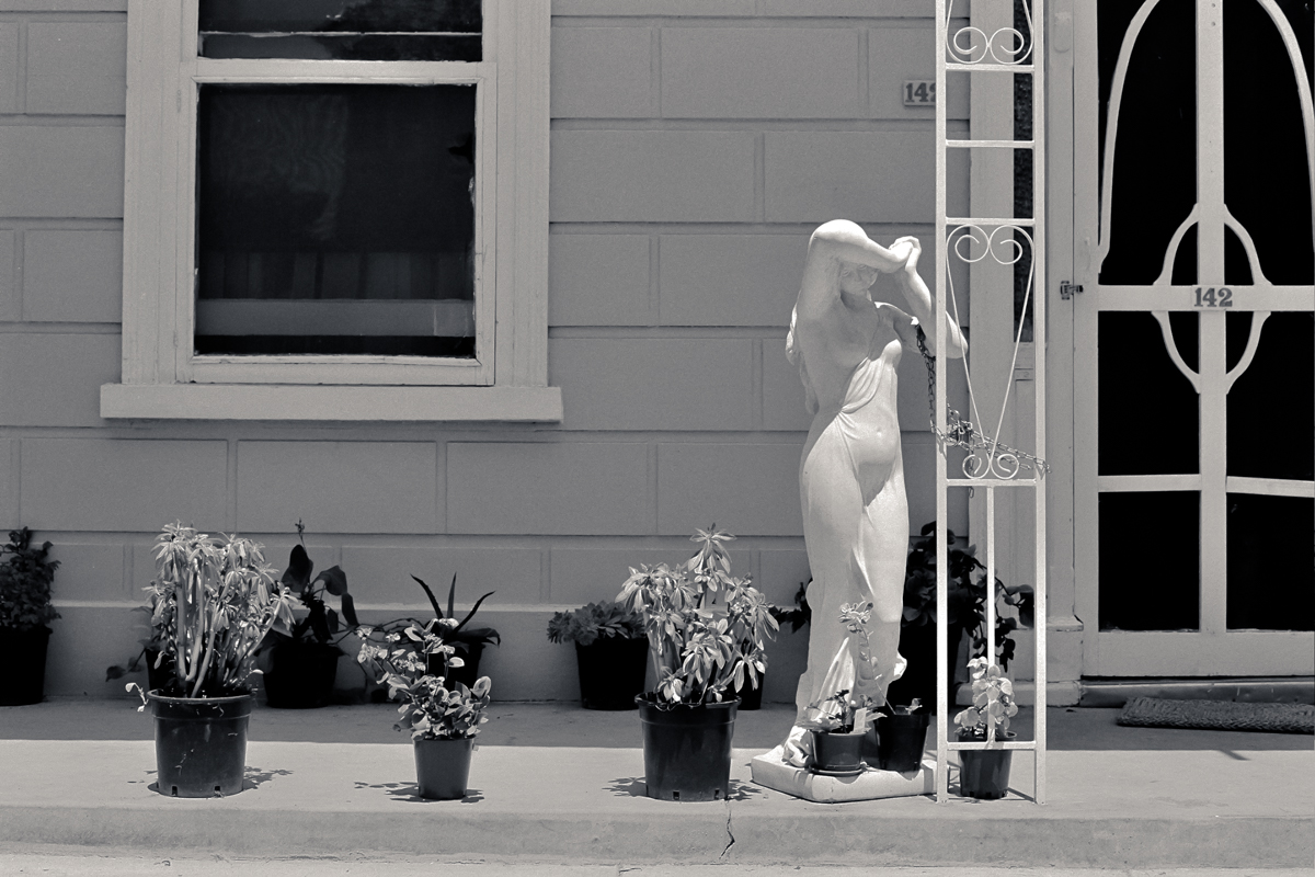 Woman chained to house [photograph, 1980]