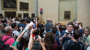 'Crowd looking at the Mona Lisa at the Louvre', photograph by Victor Grigas.
